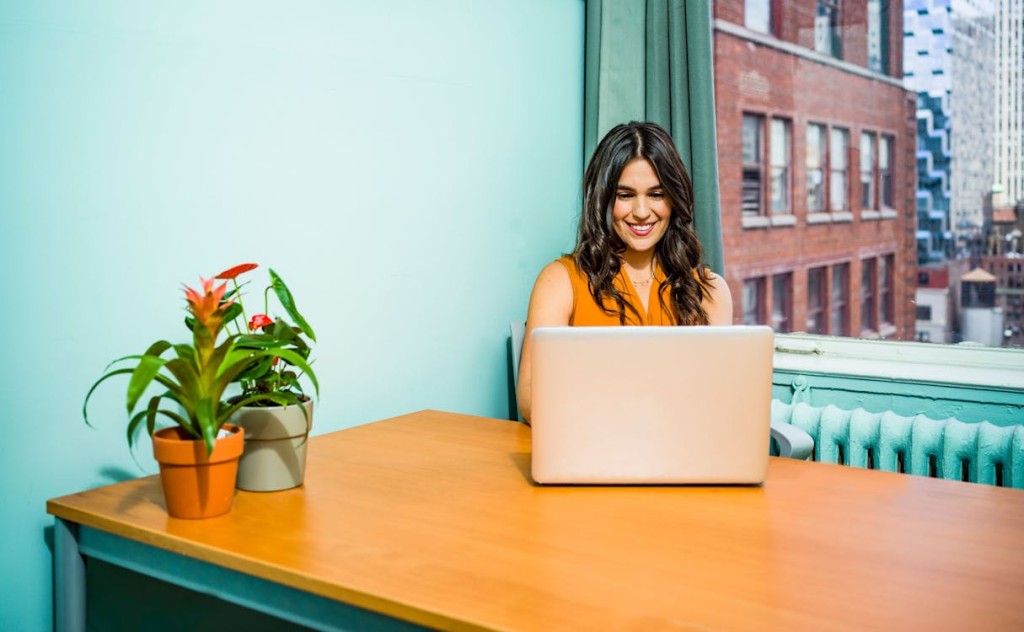 Person typing email campaign on laptop