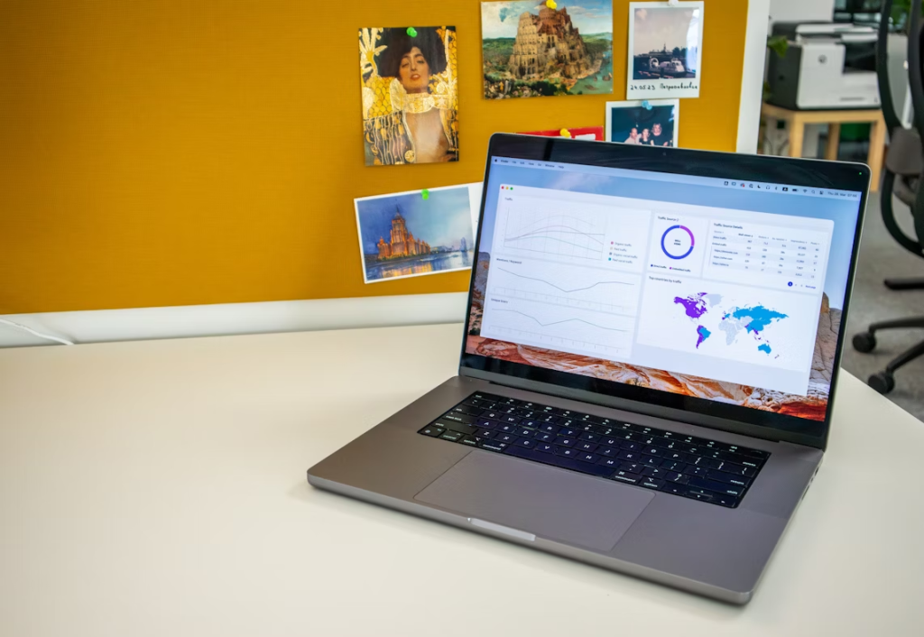 Laptop screen showing charts for safelist mailer for traffic generation