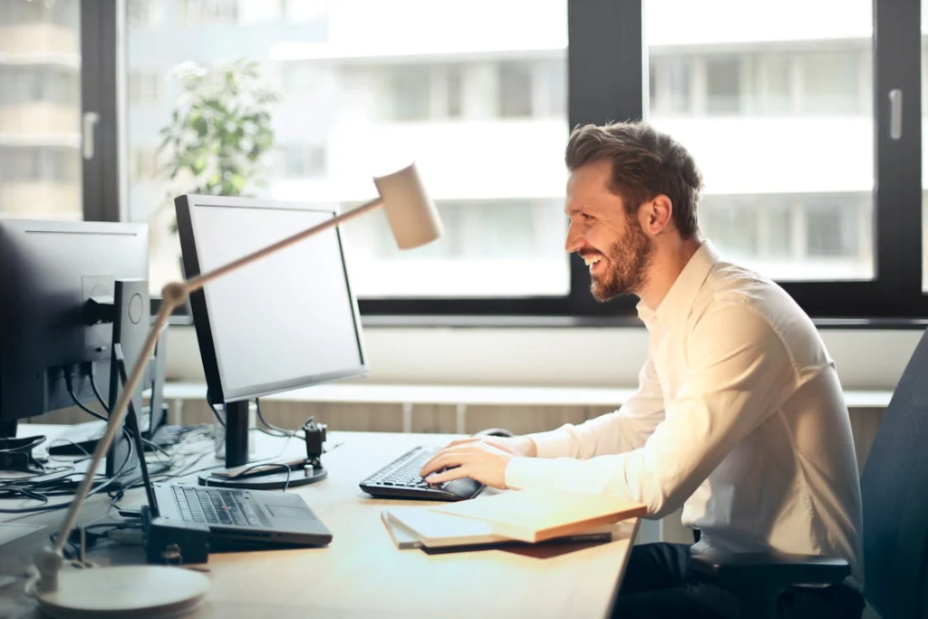 Man working on email marketing strategy using a desktop computer